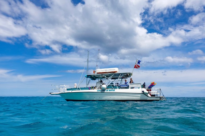 a small boat in a large body of water